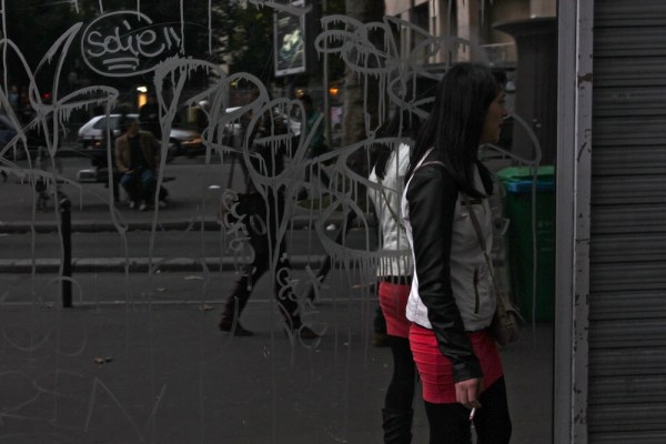 On "Hooker Street" in the Belleville District. Dozens of middle-aged  Asian women can be seen loitering in short mini-skirts and jackets, smoking cigarettes and looking bored.